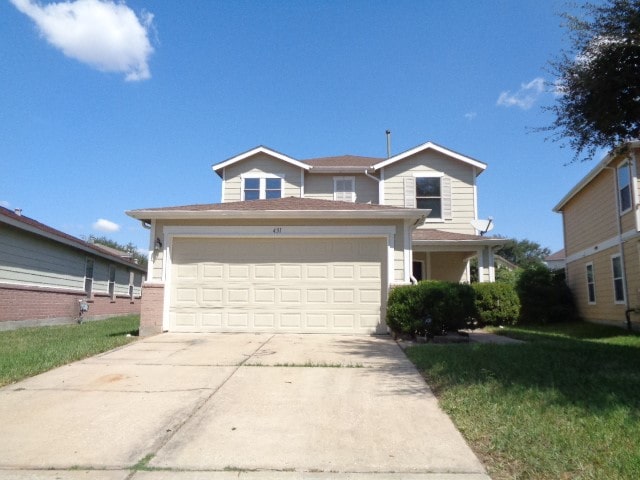 front facade with a front lawn and a garage