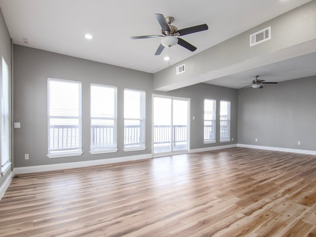 interior space featuring light wood-type flooring and ceiling fan