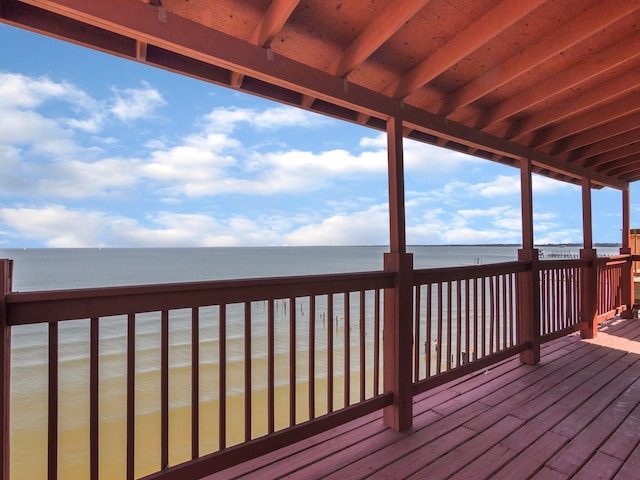 wooden deck featuring a water view