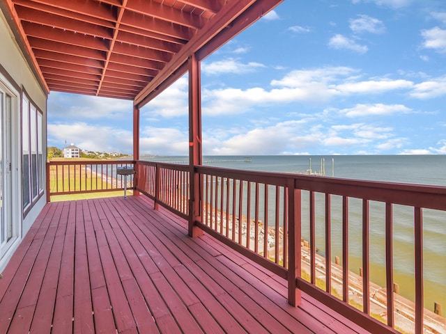 wooden deck featuring a water view