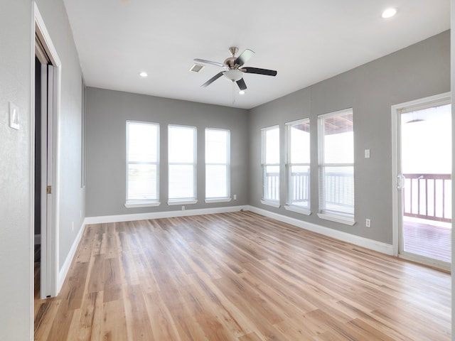 spare room with ceiling fan and light hardwood / wood-style flooring