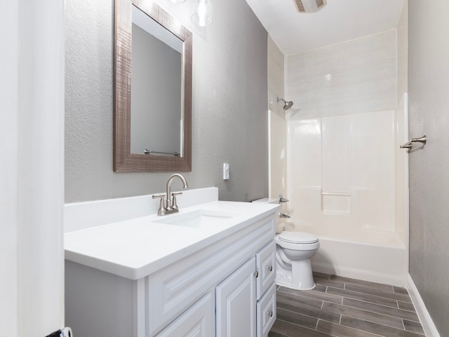 full bathroom featuring toilet, hardwood / wood-style flooring, vanity, and  shower combination