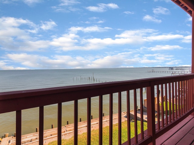 wooden deck featuring a water view