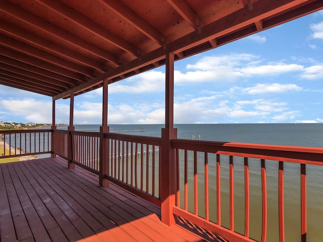 wooden deck with a water view