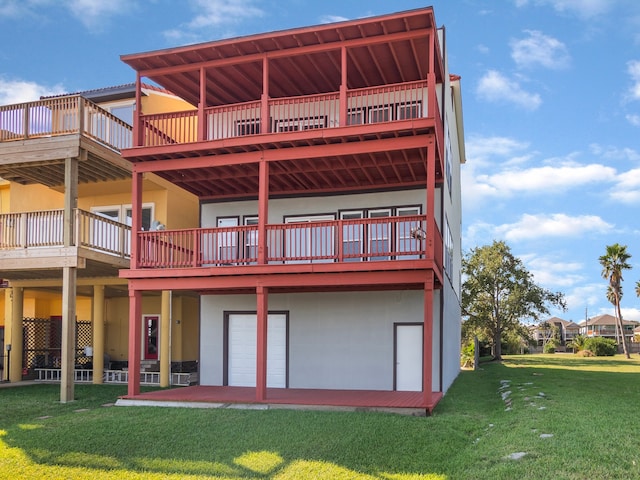 back of house with a wooden deck and a yard