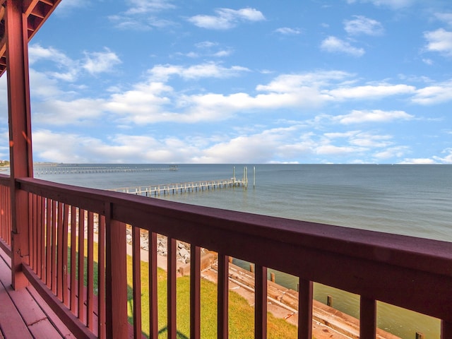 exterior space with a water view and a view of the beach