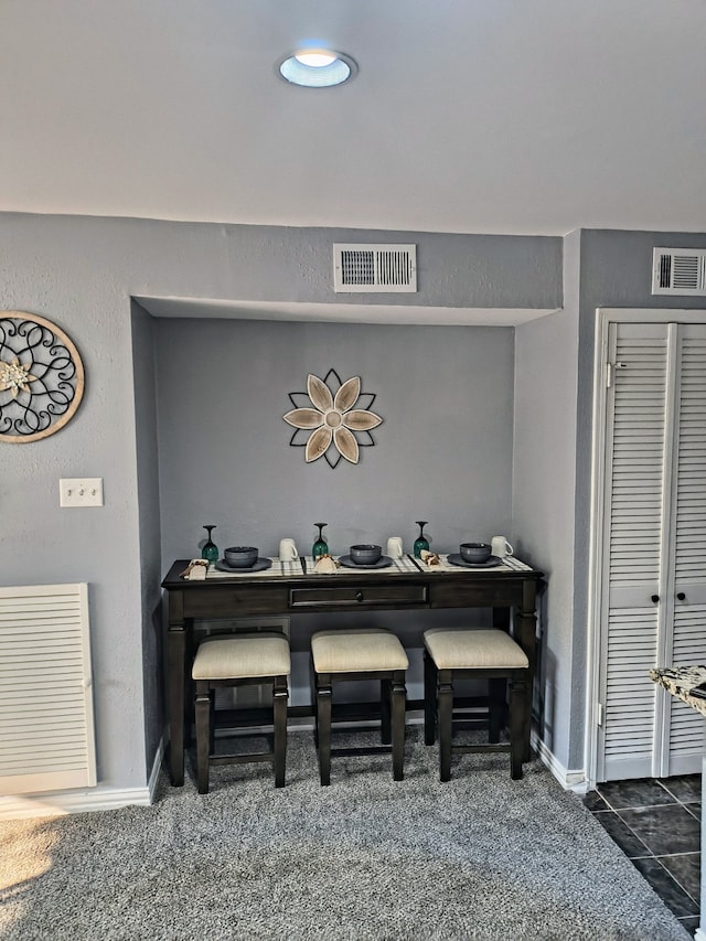 12100 Melville Dr Unit 406D, Montgomery, TX 77356 - detailed view of baseboards and carpet