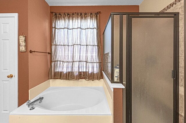 bathroom with separate shower and tub