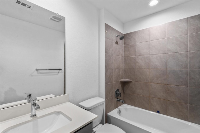 full bath with visible vents, toilet, recessed lighting, shower / bath combination, and vanity