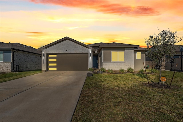 8102 Buck Ln, Rosharon, TX 77583 - view of front of home featuring brick siding, an attached garage, concrete driveway, and a front lawn
