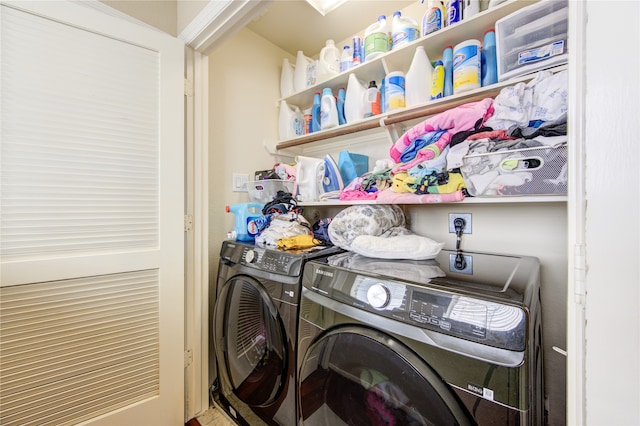 clothes washing area with separate washer and dryer