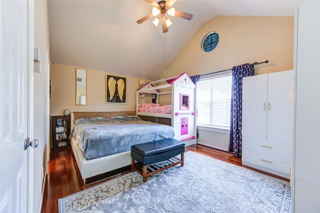 bedroom featuring wood finished floors, vaulted ceiling, and a ceiling fan