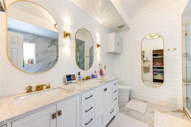 full bath with marble finish floors, an enclosed shower, lofted ceiling, double vanity, and toilet