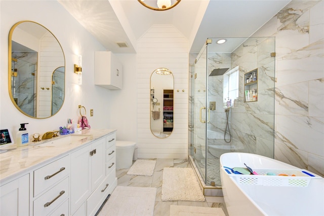 full bath featuring marble look tiles, a shower stall, a freestanding bath, vanity, and recessed lighting