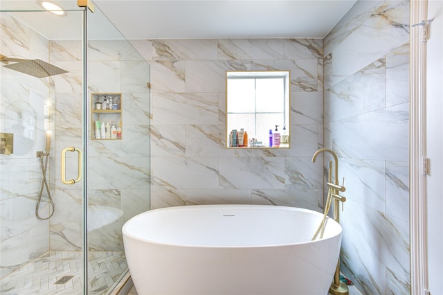 full bathroom with a stall shower, tile walls, and a soaking tub
