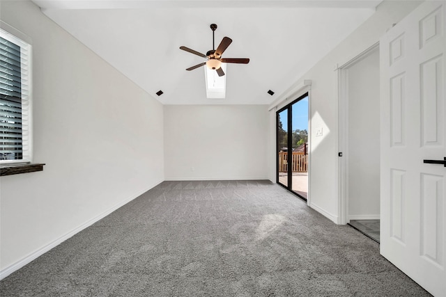 empty room with carpet floors, ceiling fan, and lofted ceiling