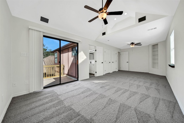 unfurnished living room featuring carpet floors, ceiling fan, and lofted ceiling