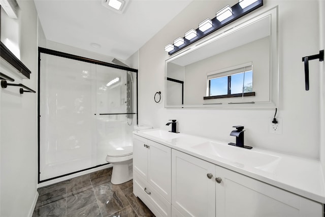 bathroom with vanity, toilet, and walk in shower