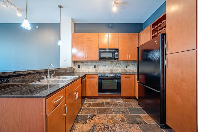 kitchen featuring decorative backsplash, hanging light fixtures, kitchen peninsula, sink, and black appliances