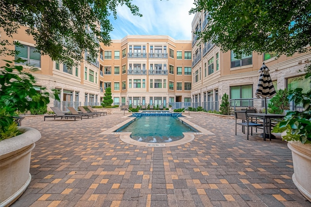 view of pool featuring a patio