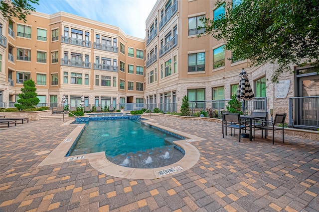 view of pool featuring a patio