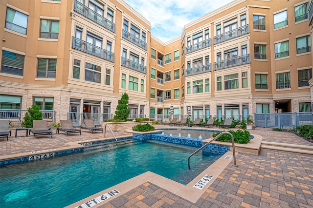 view of pool featuring a patio