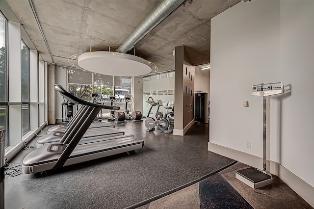 workout area with floor to ceiling windows