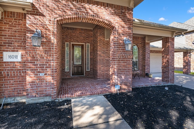 view of exterior entry featuring a garage