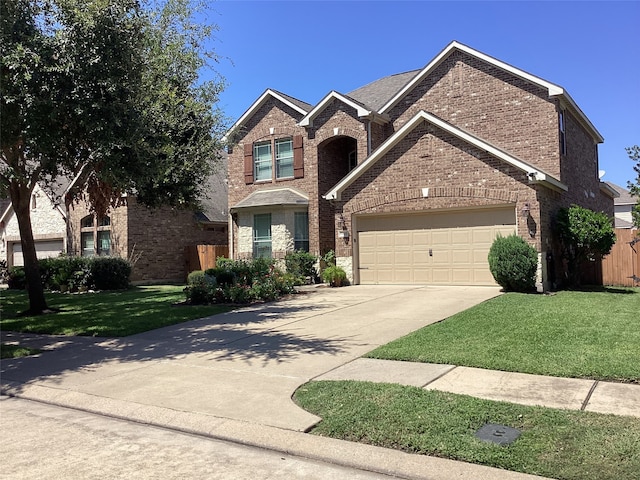 view of front property with a front yard and a garage