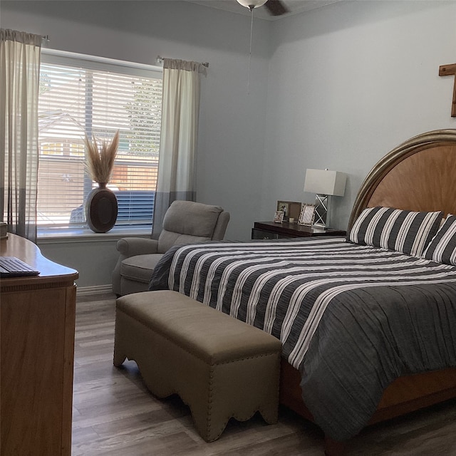 bedroom with hardwood / wood-style flooring