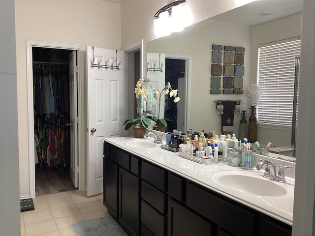 bathroom with tile patterned floors and vanity