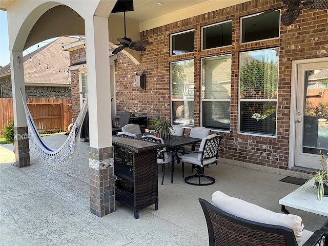 view of patio featuring ceiling fan