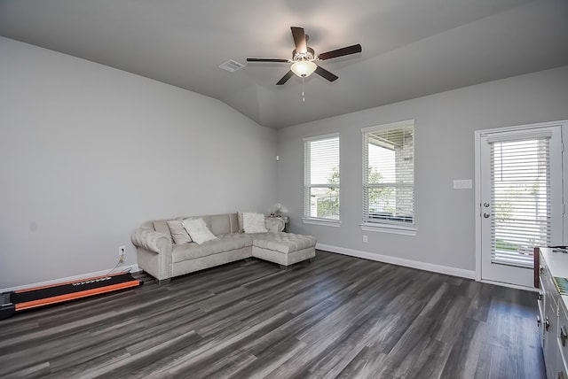 unfurnished living room featuring lofted ceiling, ceiling fan, and dark hardwood / wood-style flooring