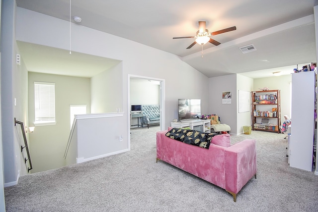 carpeted living room featuring vaulted ceiling and ceiling fan