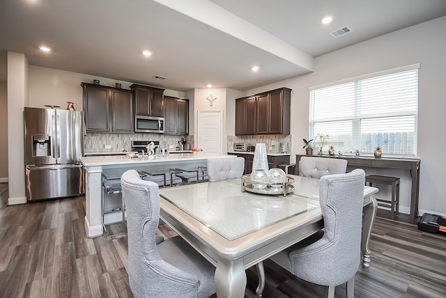 dining area featuring dark hardwood / wood-style flooring