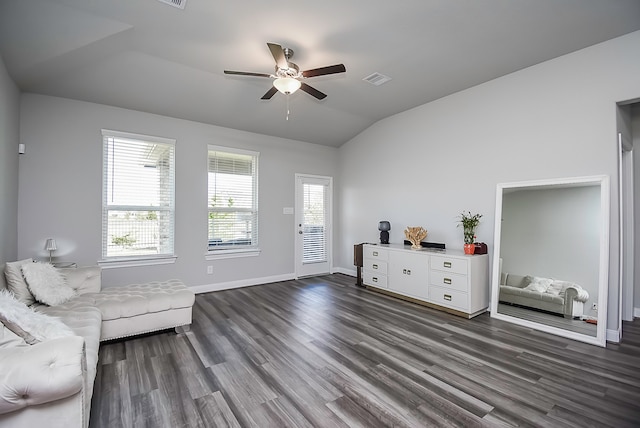 living room with dark wood-type flooring, ceiling fan, and lofted ceiling