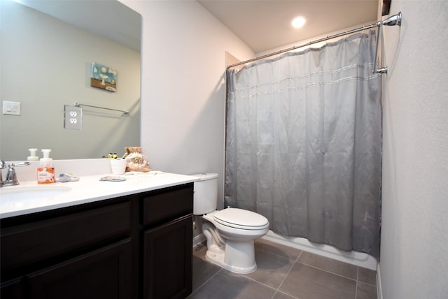 full bathroom featuring vanity, toilet, shower / bathtub combination with curtain, and tile patterned flooring