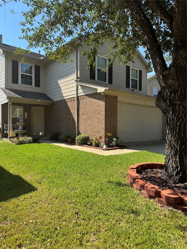 view of front facade with a garage and a front yard