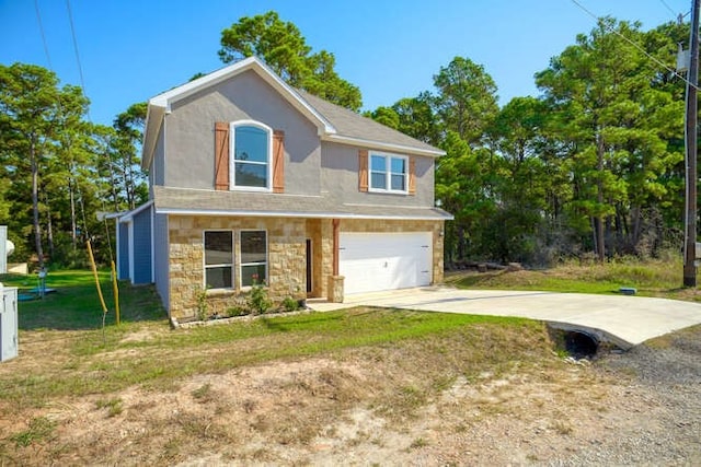 view of front of home with a garage and a front lawn