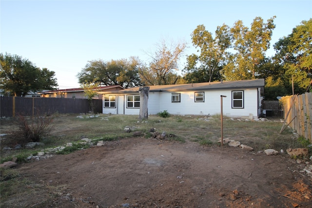 rear view of house with central air condition unit