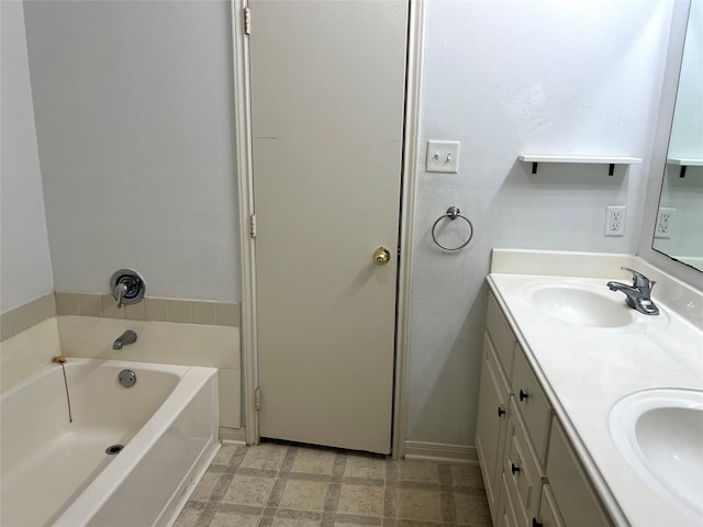 bathroom featuring vanity and a bath