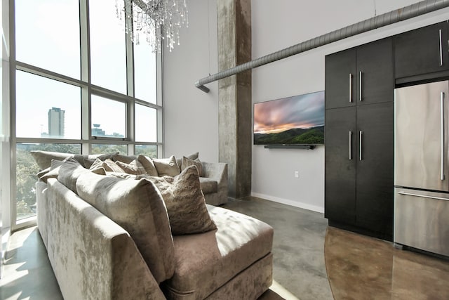 living room featuring plenty of natural light and a high ceiling