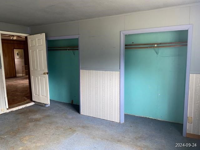 unfurnished bedroom featuring crown molding