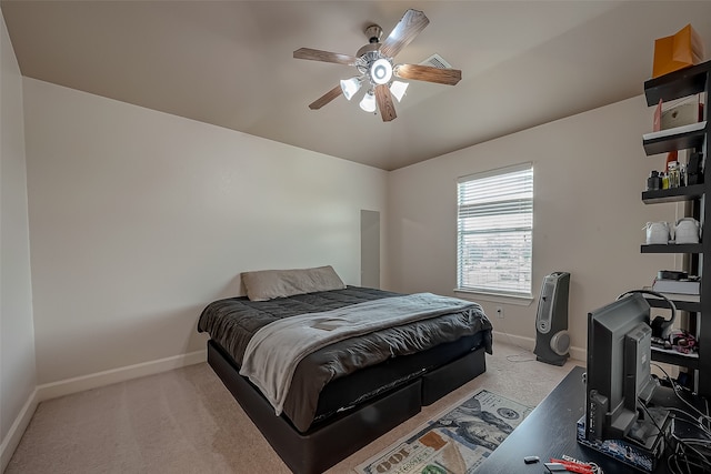 bedroom featuring light carpet and ceiling fan