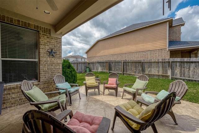 view of patio featuring ceiling fan