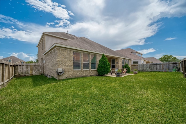 back of property featuring a patio and a lawn