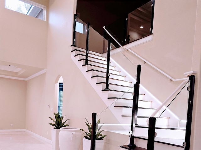 stairway with a towering ceiling