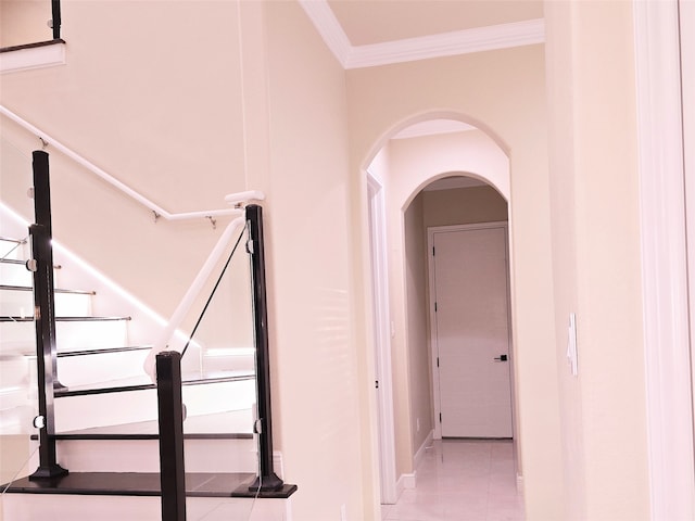 interior space with tile patterned flooring and crown molding