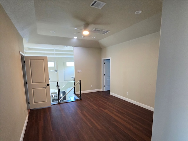 unfurnished room with ceiling fan, dark wood-type flooring, and a textured ceiling