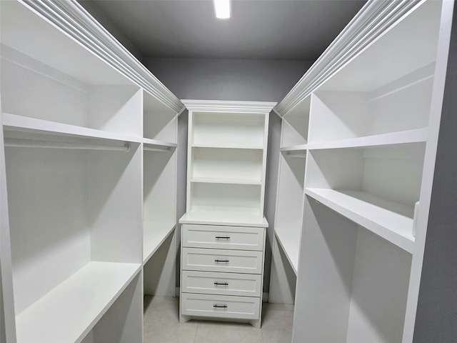 walk in closet featuring light tile patterned floors